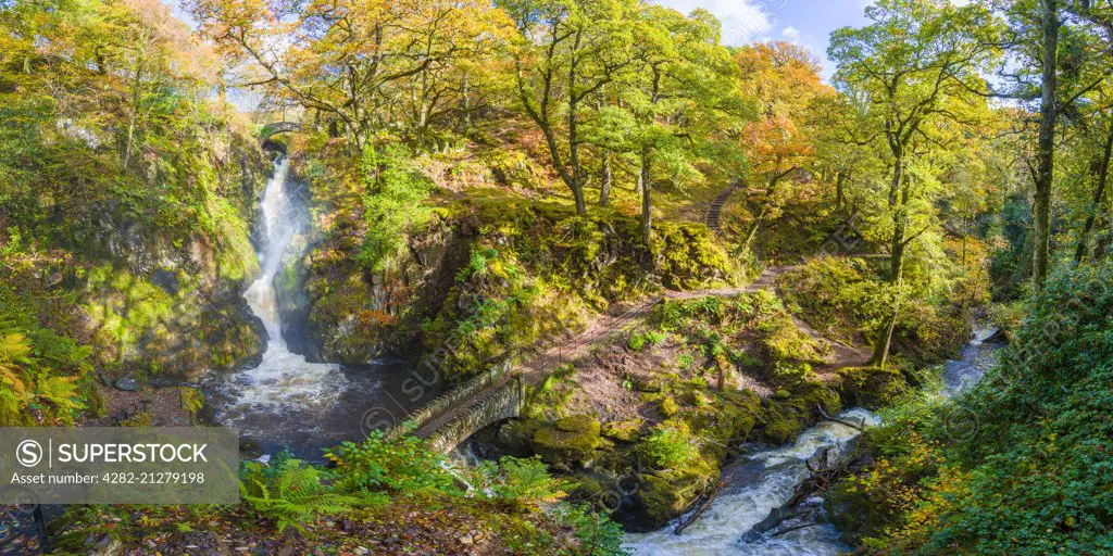 Aira Force waterfall and Aira Beck in the Lake District National Park in autumn.