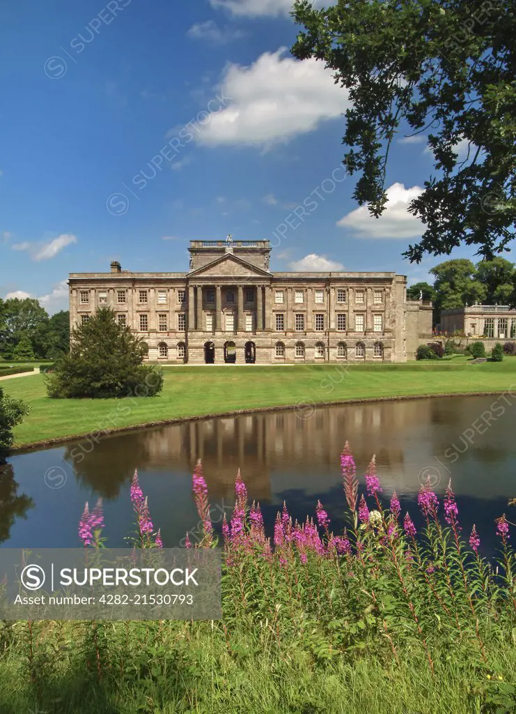 Lyme Hall and Reflection Lake in Lyme Park.