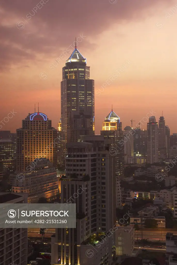 View over city at sunset in Bangkok.