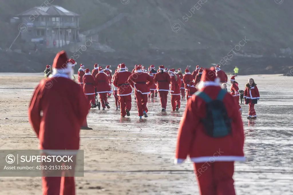 The annual santa run at Fistral Beach in Cornwall. 