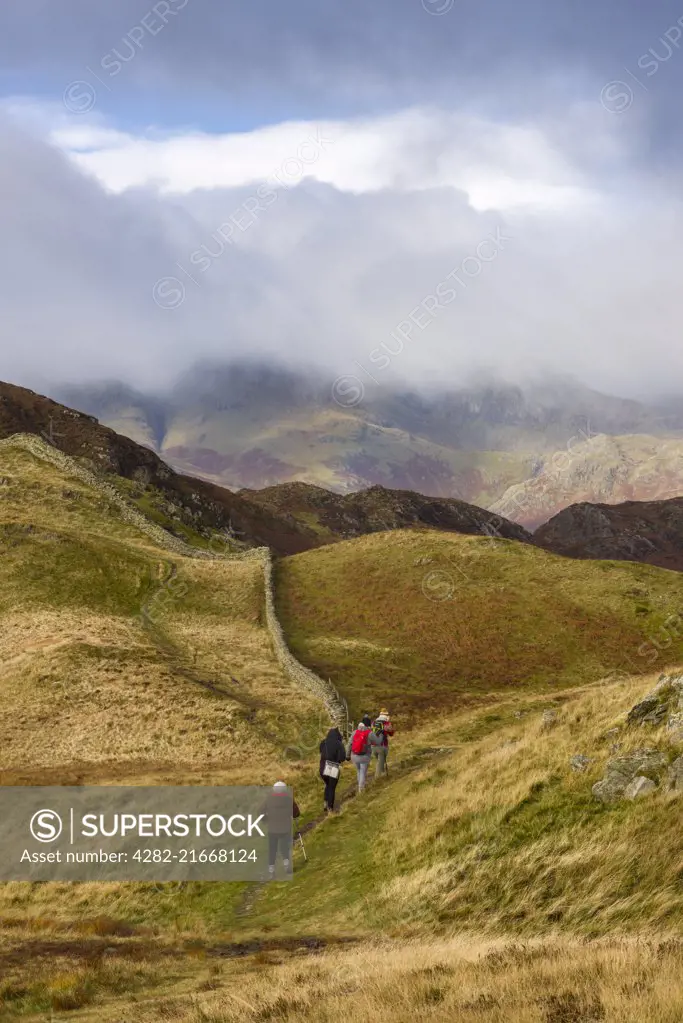 Fell walkers on Lingmoor Fell in the Lake District National Park.