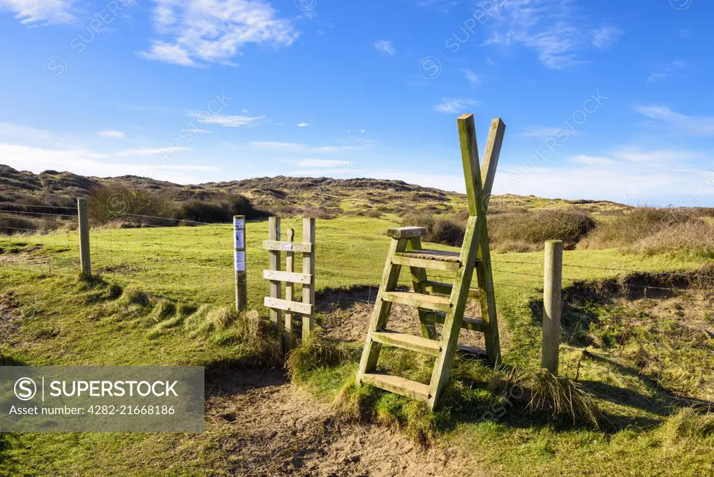 A stile over a fence into Braunton Burrows on the North Devon Coast.