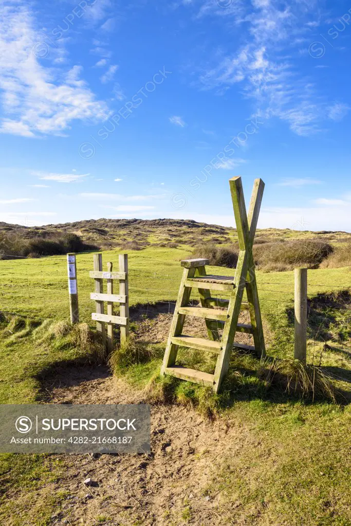 A stile over a fence into Braunton Burrows on the North Devon Coast.