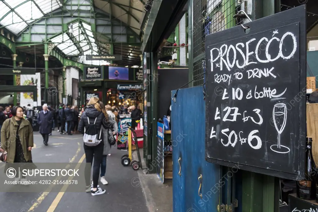 A sign advertising the price of Prosecco in Brough Market in London.