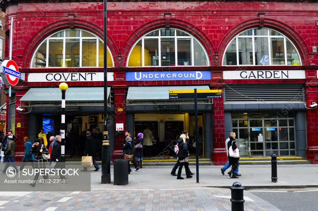 England, London, Covent Garden. People passing the entrance to Covent Garden Underground Station.