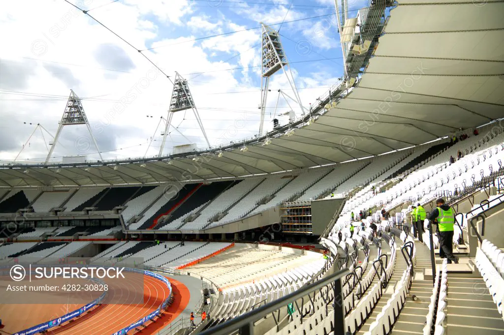 England, London, Stratford . An interior view of the Olympic stadium looking down onto the running track.