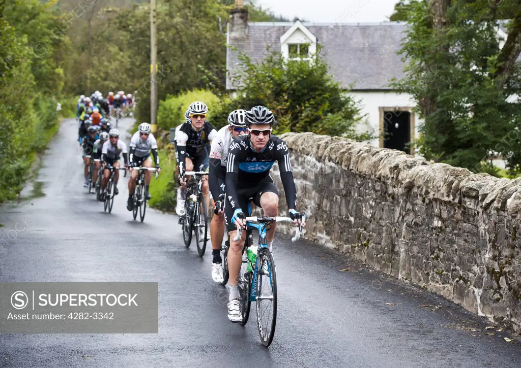 Scotland, Scottish Borders, Tweedsmuir. The peloton on stage one of the 2011 Tour of Britain race over the River Tweed at Tweedsmuir in the Scottish Borders approx 90 minutes into the race.