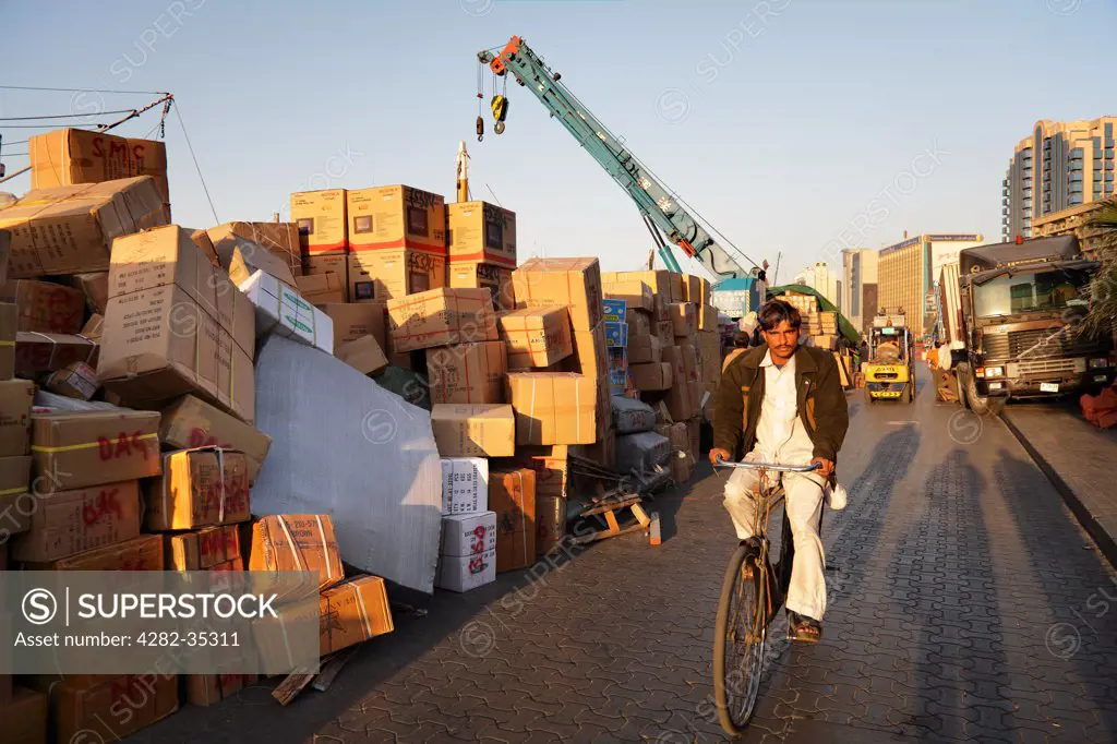 United Arab Emirates, Dubai, Dubai Creek. A dockside worker on his way home.