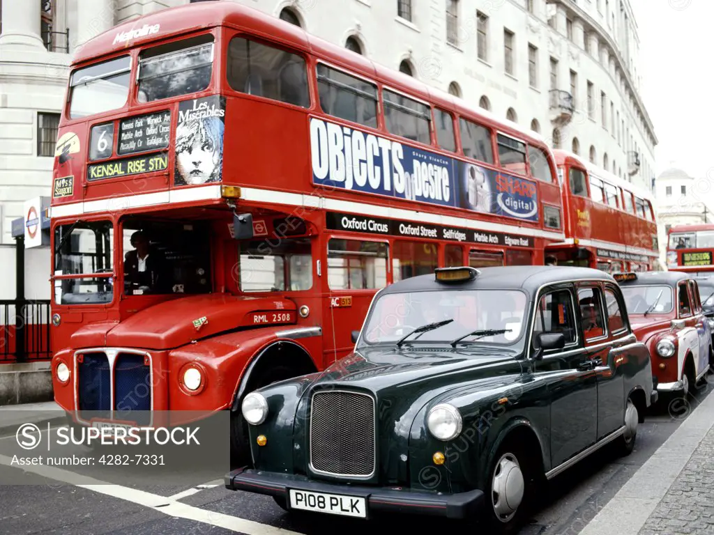 England, London, London. Routemaster bus and black cab.