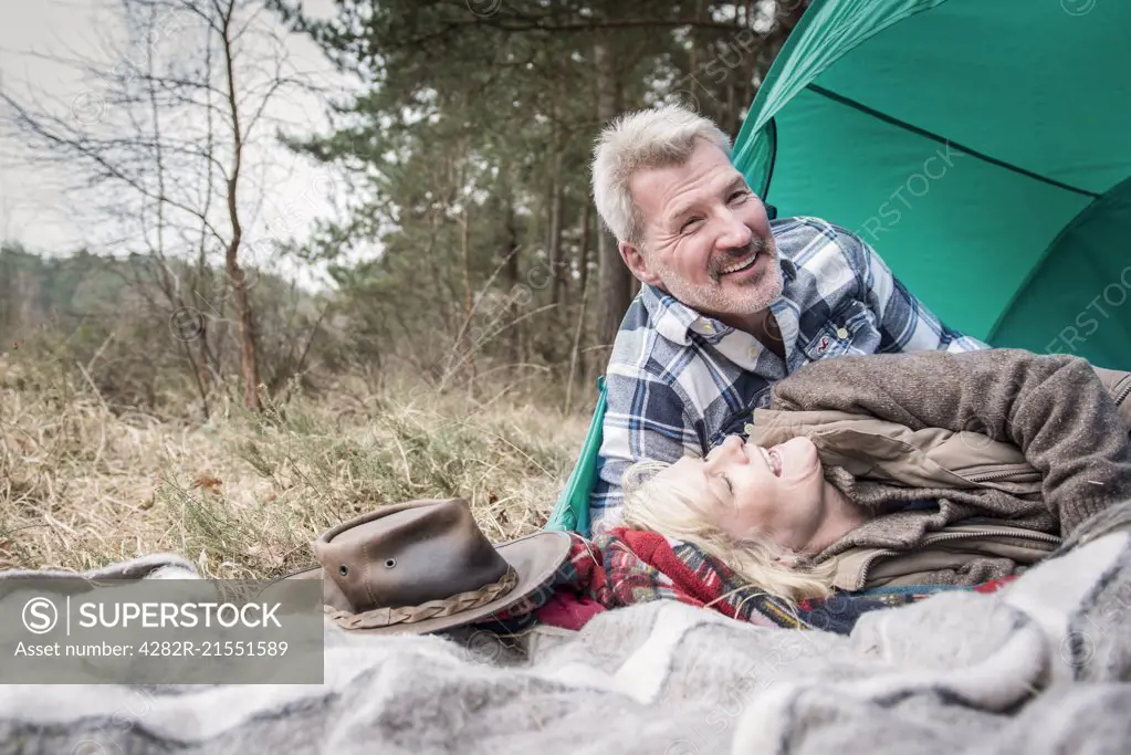 Senior couple enjoying being together at their campsite.