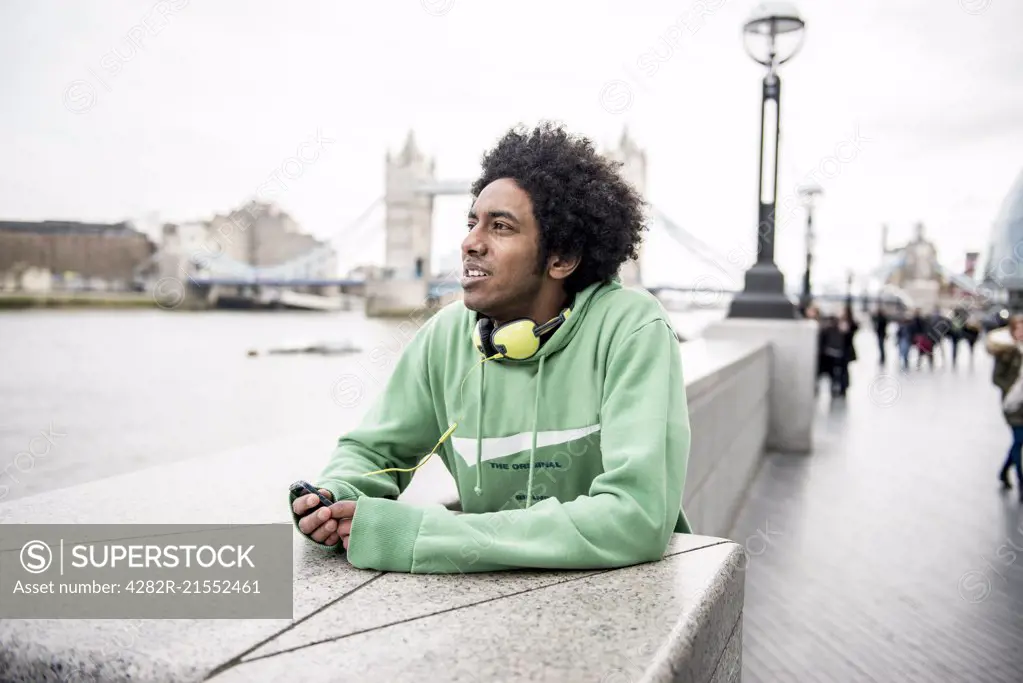 A young man enjoying the view on the South Bank in London.