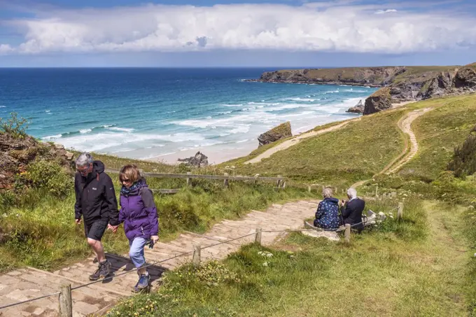 Walkers on the South West Coast path at Carnewas and Bedruthan Steps on the North Cornwall coast.