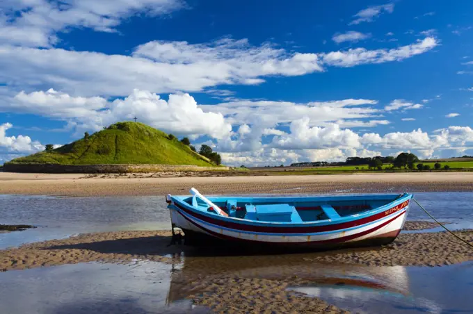 England, Northumberland, Alnmouth. Boats on the tidal Aln Estuary at Alnmouth. The hill in the distance is known as Church Hill.