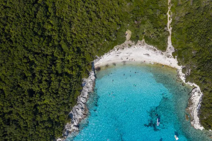 Aerial of an isolated beach with turquoise waters in Greece.