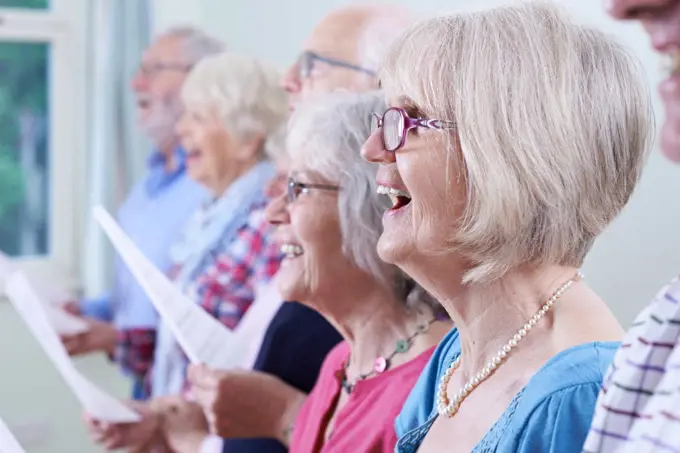 Group Of Seniors Singing In Choir Together