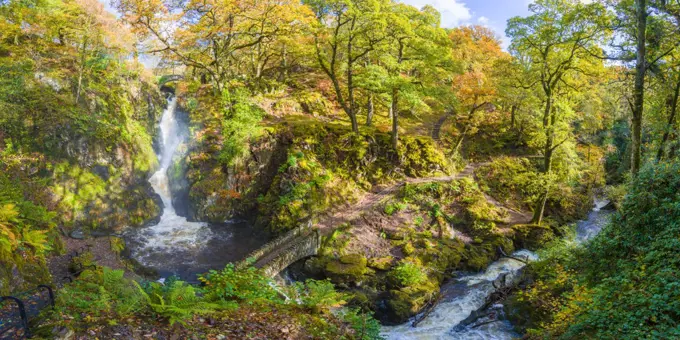 Aira Force waterfall and Aira Beck in the Lake District National Park in autumn.