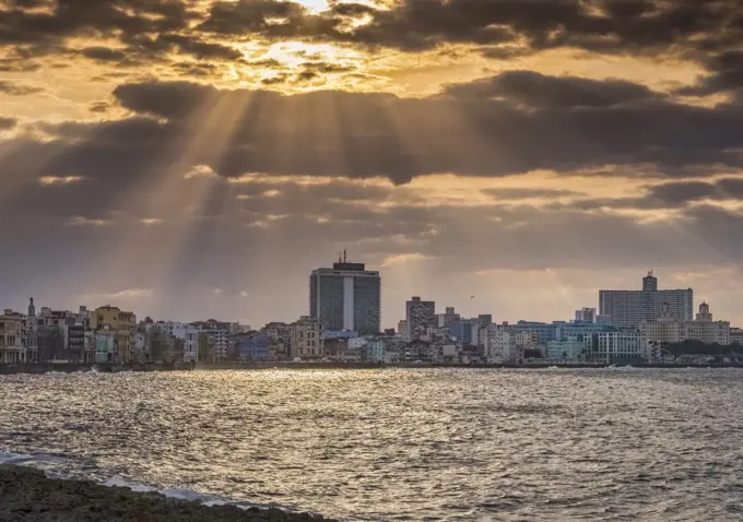 Sunburst and crepuscular rays over The Malecon in Havana.