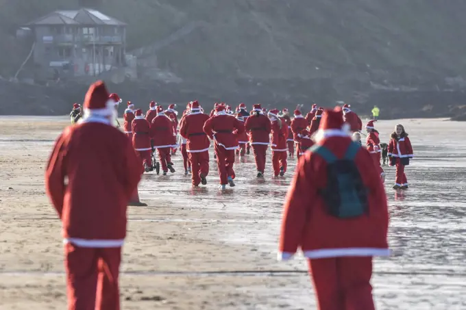 The annual santa run at Fistral Beach in Cornwall. 