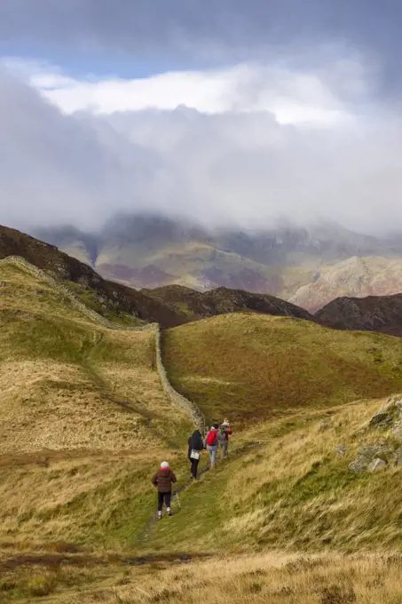 Fell walkers on Lingmoor Fell in the Lake District National Park.