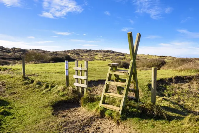 A stile over a fence into Braunton Burrows on the North Devon Coast.