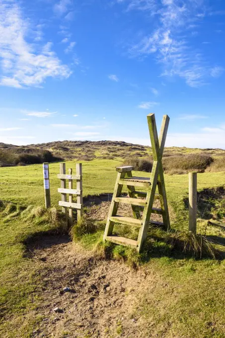 A stile over a fence into Braunton Burrows on the North Devon Coast.
