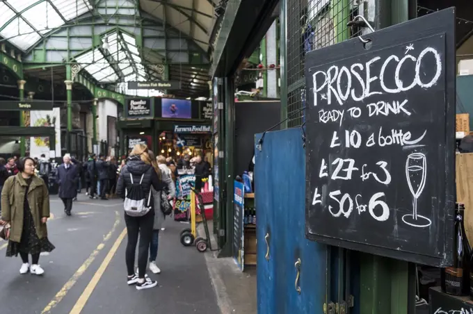 A sign advertising the price of Prosecco in Brough Market in London.