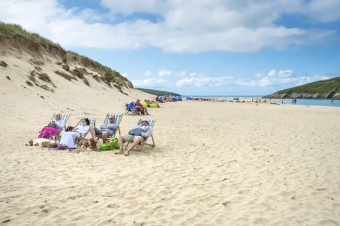 Holidaymakers on Crantock Beach in Newquay in Cornwall.