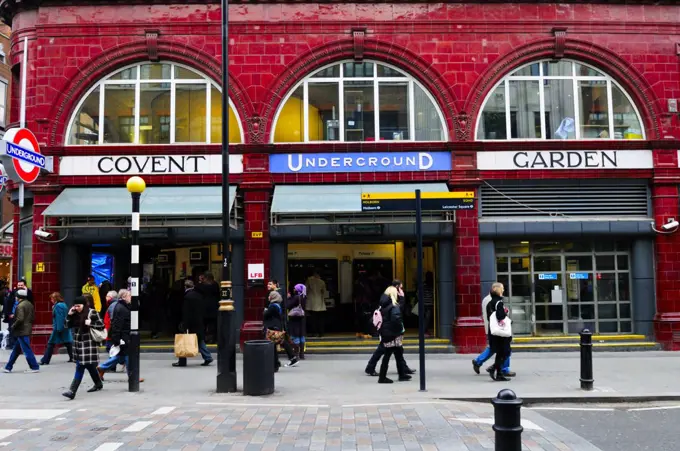 England, London, Covent Garden. People passing the entrance to Covent Garden Underground Station.