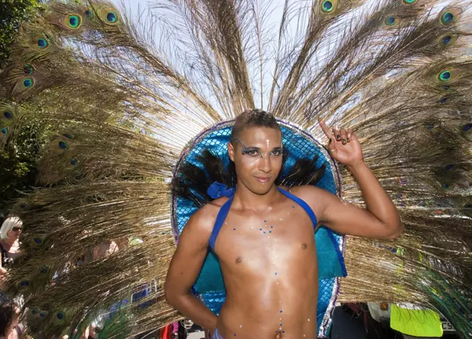 England, East Sussex, Brighton. A man in costume taking part in the annual Gay Pride Parade in Brighton.