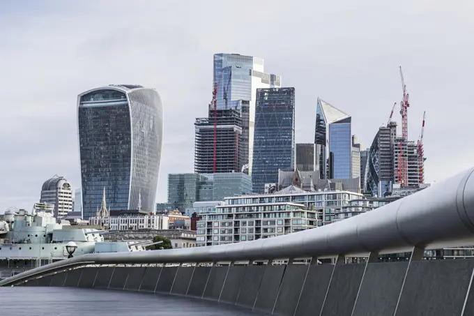 The Square Mile of London's financial district pictured over a curve around The Scoop on the London waterfront.