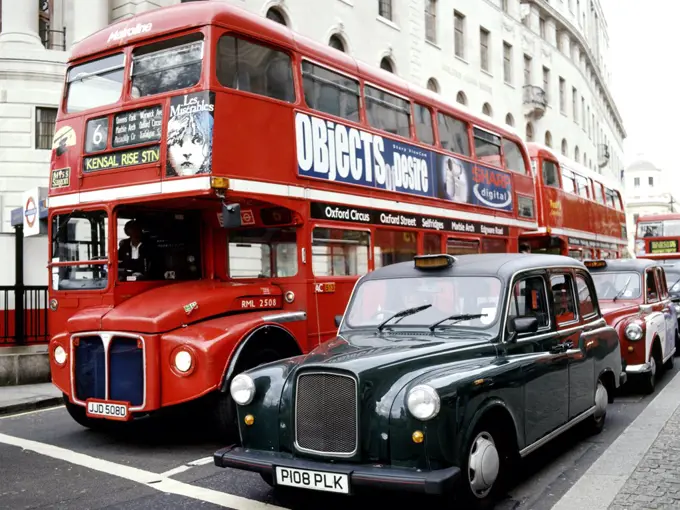 England, London, London. Routemaster bus and black cab.