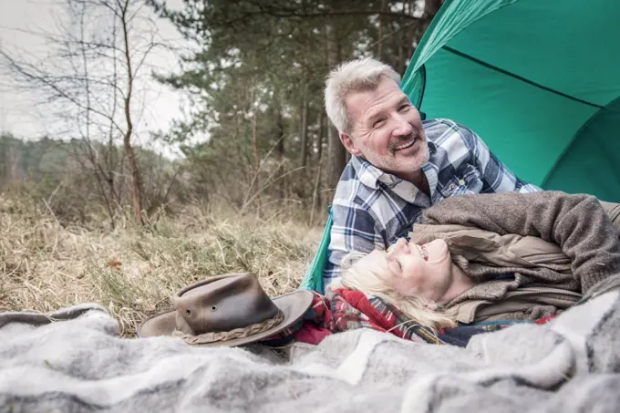 Senior couple enjoying being together at their campsite.