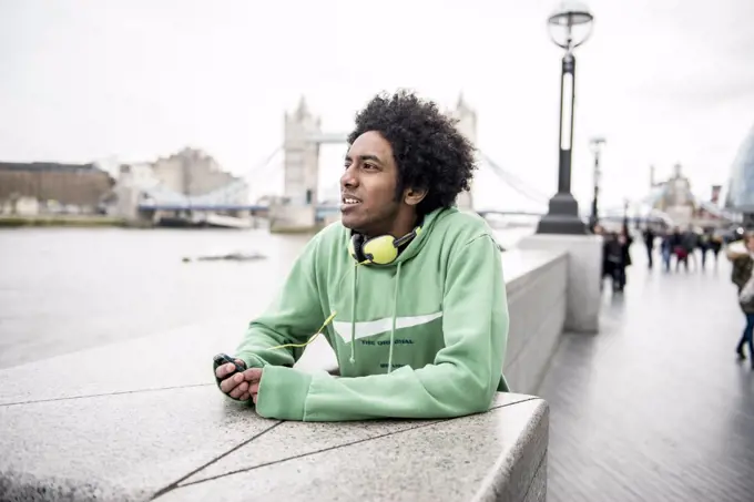 A young man enjoying the view on the South Bank in London.