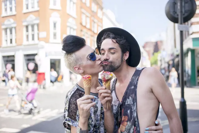 A gay couple enjoy an ice cream on a day out in London.