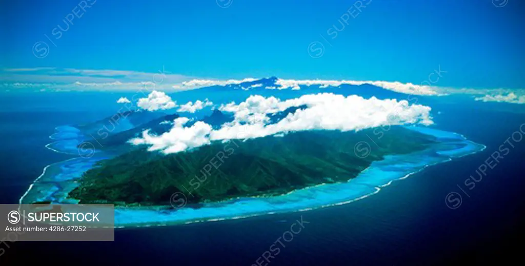 Aerial view of Moorea with Tahiti beyond in French Polynesia