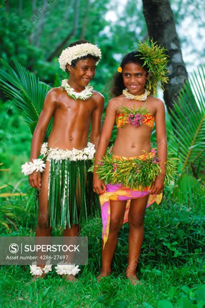 Polynesian boy and girl on Aitutaki in local dance costumes  Cook Islands  South Pacific