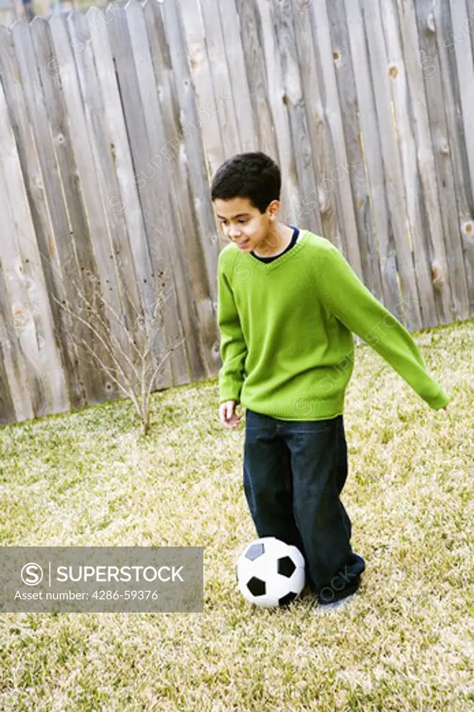 Boy playing with a soccer ball