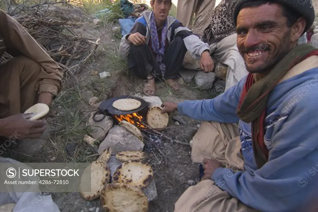 A Balti man making chapatis in Pakistan