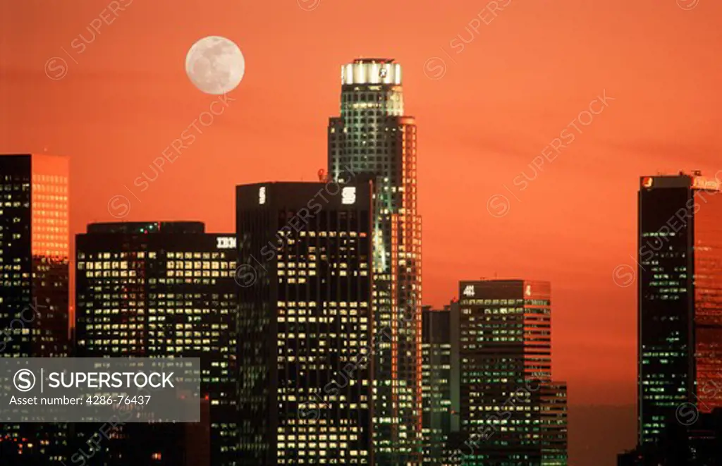 Sunset skies and full moon over downtown Los Angeles office buildings from Elysian Park