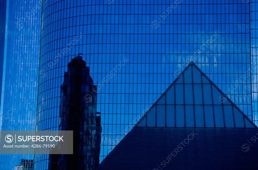 Glass building with reflections of a pyramid of the Museum of Contemporary Art in Los Angeles, CA