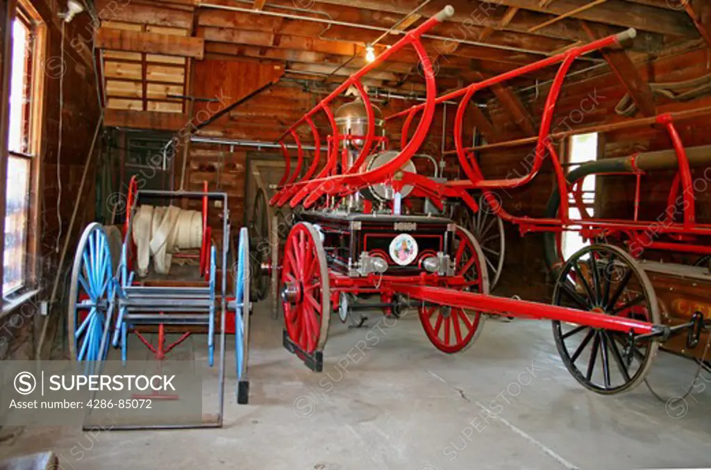 Vintage firefighting equipment in old firehouse in historic Columbia State Historic Park Mother Lode gold rush town in California