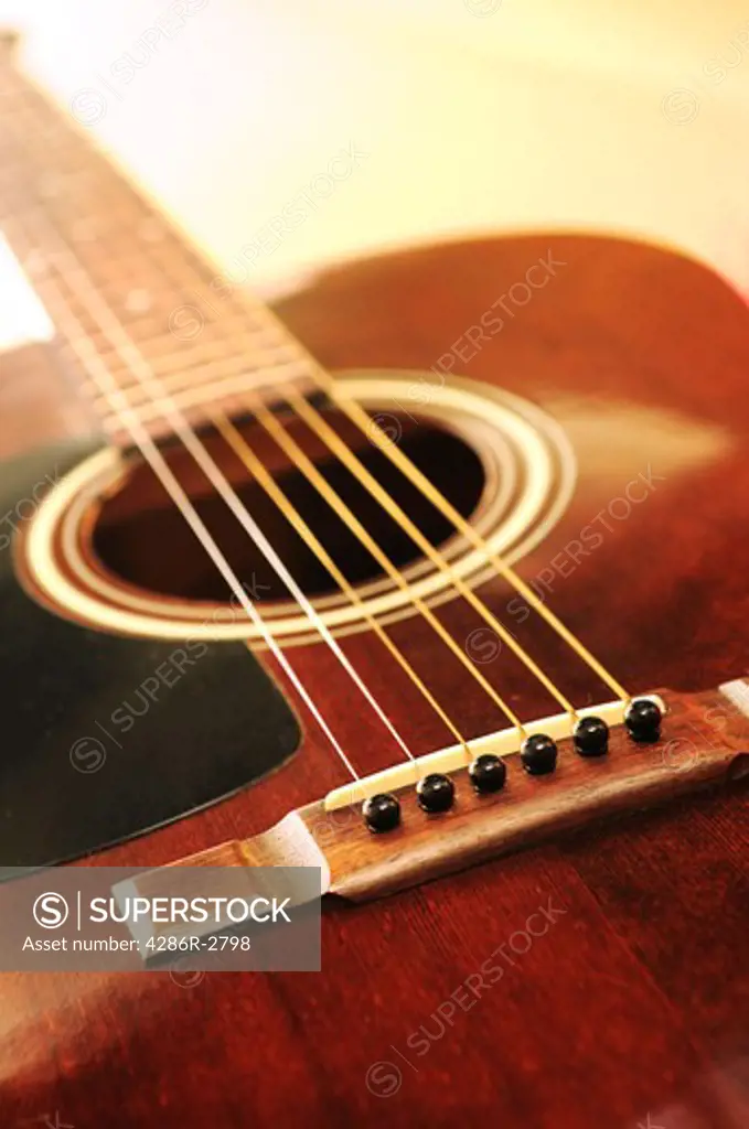 Musical instrument acoustic guitar close up in perspective