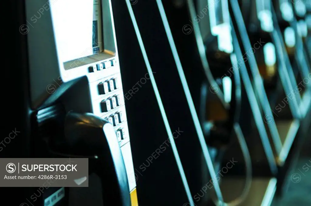 Row of pay phones in airport close up