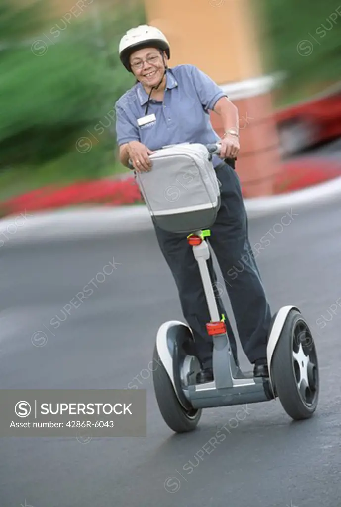 Portrait of female security guard posed on segway