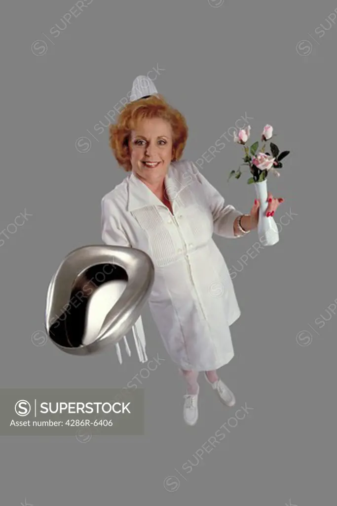 Humorous birdseye view of nurse holding bed pan and vase of flowers