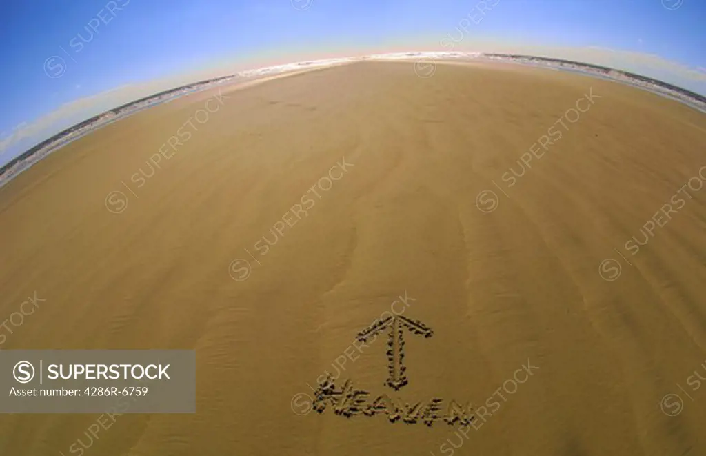 The word Heaven, written in the sand - arrow pointing upward.