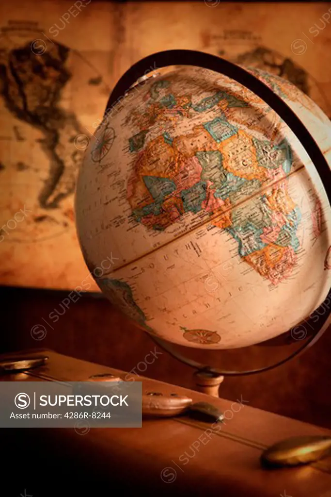 Antique globe, map and suitcase