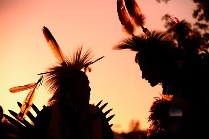 Native American indians at sunset