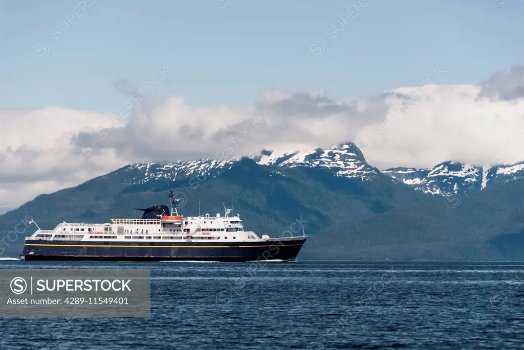 Alaska State Ferry MV Taku crosses Frederick Sound in Southeast Alaska; Coast Range in background