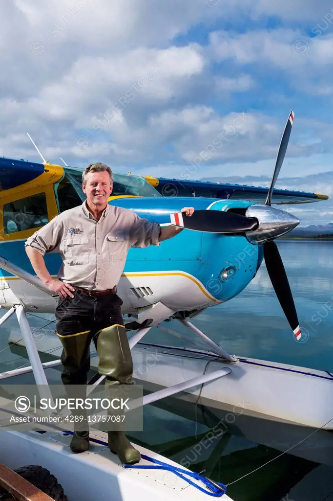 Tikchik Narrows Lodge owner, Bud Hodson, standing in front of one of his float planes, Tikchik Lake, Wood-Tikchik State Park, Southwestern Alaska, USA